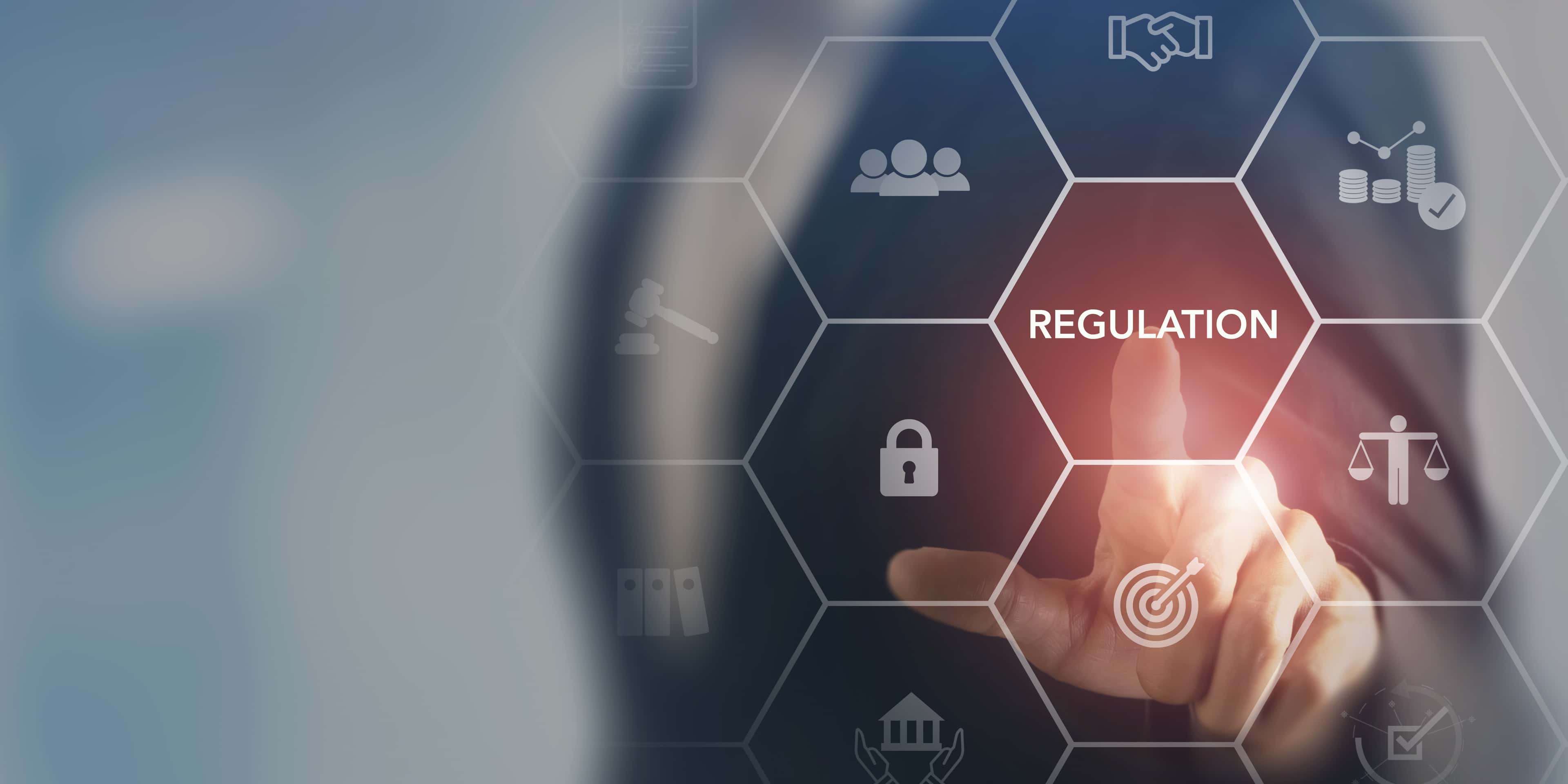 A hand points to a hexagonal grid with icons, highlighting the word "REGULATION" in the center, symbolizing business compliance and governance.