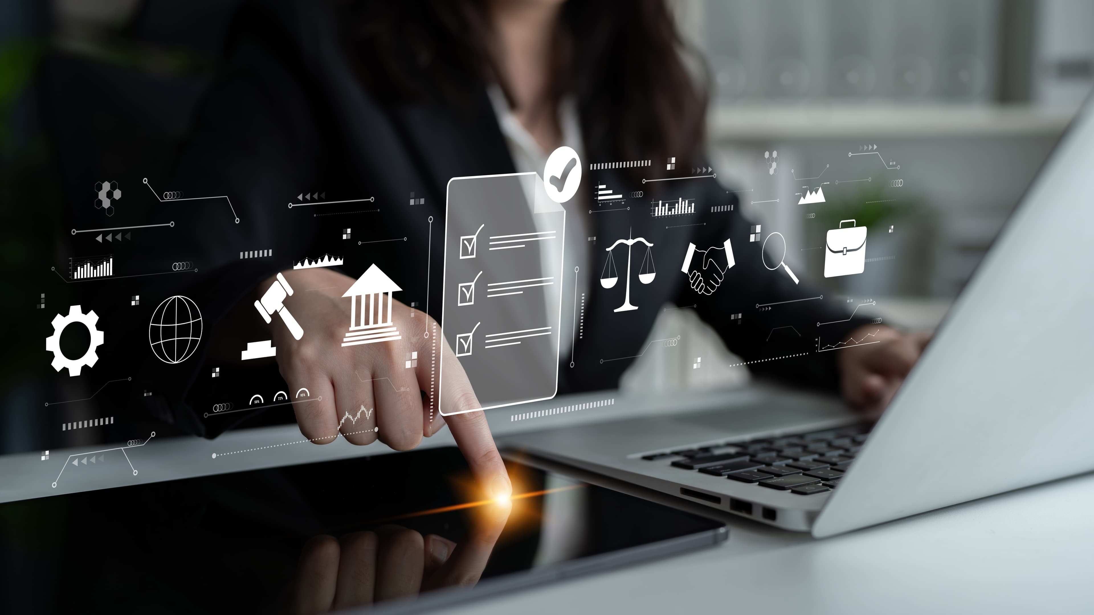 Risk & Regulatory Compliance: Professionals collaborating with digital tools to navigate evolving regulatory requirements.