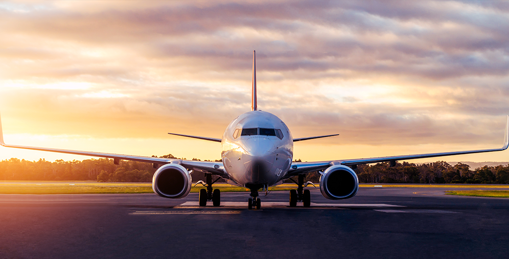 Image of plane landing on a runway