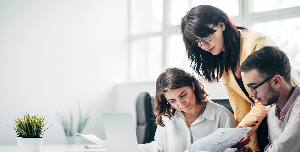 Image of team working on a project in office