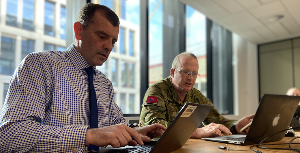 Simon Bell working on a laptop