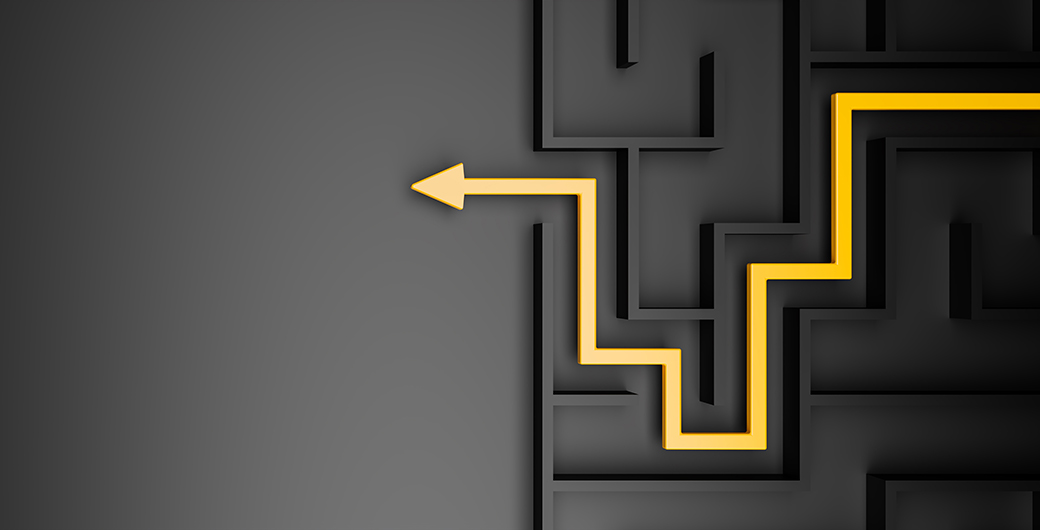 Black maze and floor with yellow solution path with arrow.