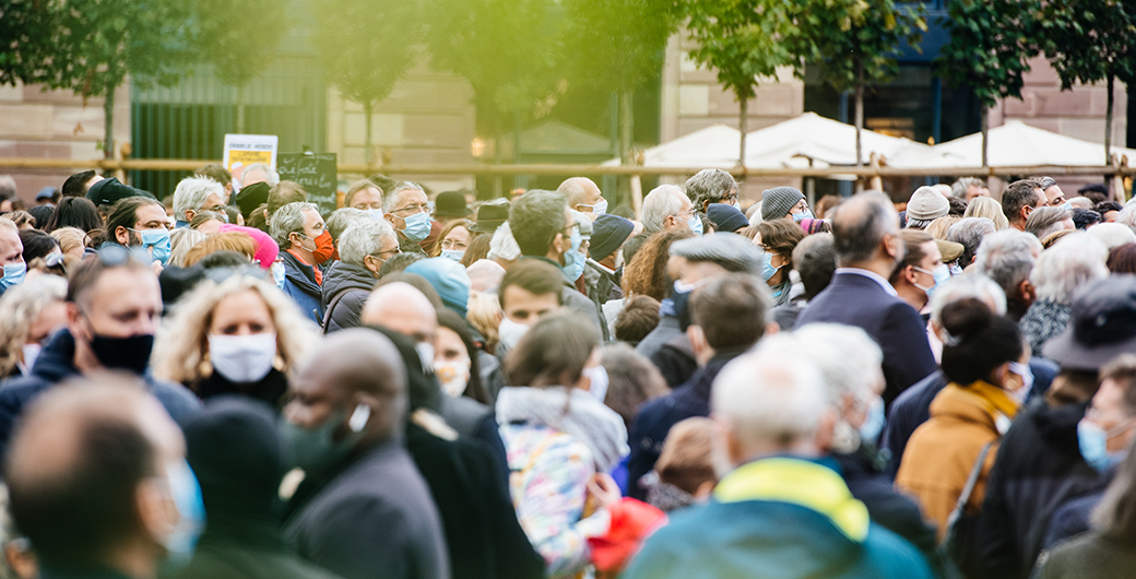 Image of a crowd of people wearing masks