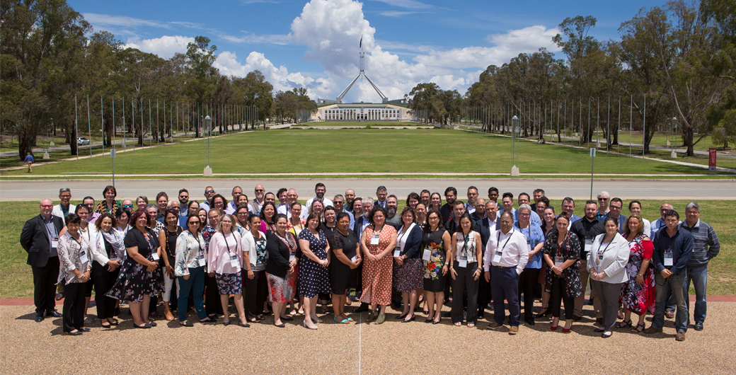 Image of a group of people standing.