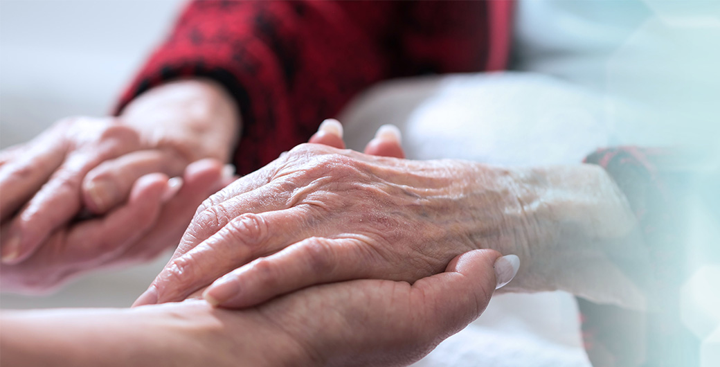 person holding an old person's hand