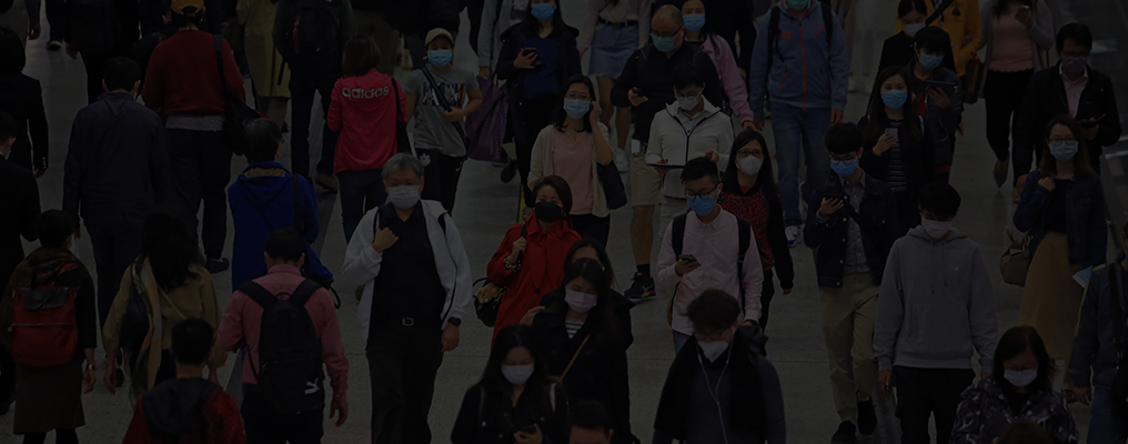 Image of people wearing masks in a crowd